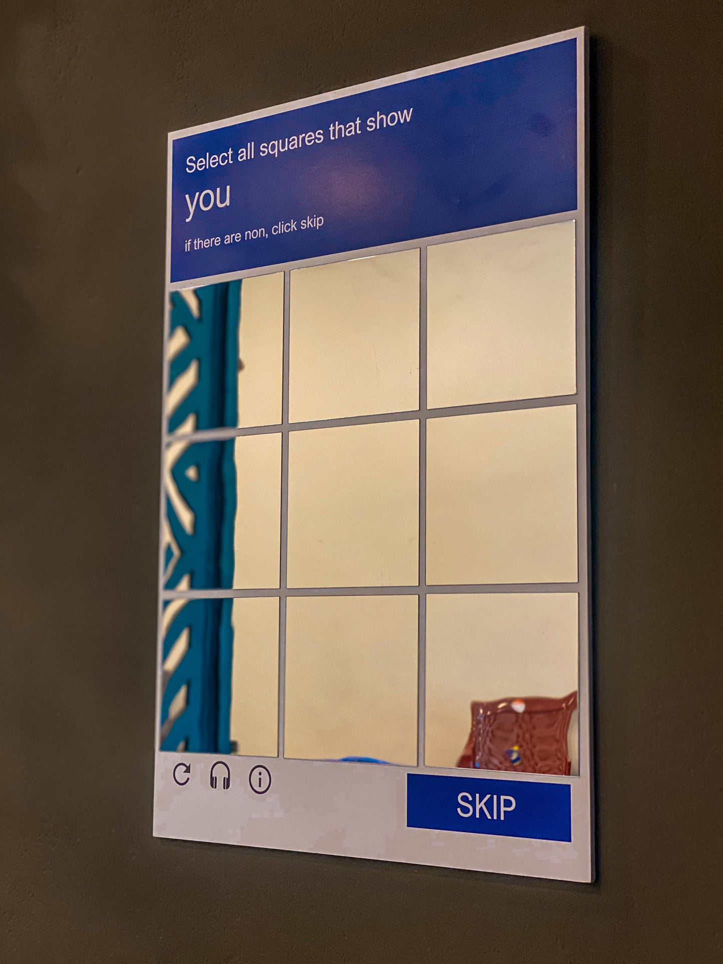 CAPTCHA wall mirror close-up showing select all squares grid design, silver acrylic novelty mirror